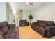 Spacious living room with hardwood floors and ample seating, perfect for relaxation and entertaining at 300 Sugar Maple Ave, Wake Forest, NC 27587