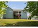 Expansive backyard featuring a spacious deck and lush green lawn at 304 Nelson Ln, Clayton, NC 27527
