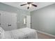 Well-lit bedroom features neutral walls, plush carpet, and a ceiling fan at 304 Nelson Ln, Clayton, NC 27527
