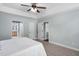 Bedroom with natural light, neutral colored walls and entry ways to the bathroom and closets at 304 Nelson Ln, Clayton, NC 27527