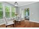 Cozy breakfast nook with a glass table, natural light and door leading to an outdoor deck at 304 Nelson Ln, Clayton, NC 27527