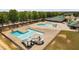 The aerial view showcases a community pool with slides, offering a relaxing and fun recreational space at 304 Nelson Ln, Clayton, NC 27527