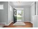 Bright foyer featuring hardwood floors and an open doorway showcasing the home's exterior at 304 Nelson Ln, Clayton, NC 27527