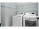 Bright laundry room features a modern washer and dryer, plus plenty of shelving for storage at 304 Nelson Ln, Clayton, NC 27527