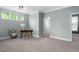 Bright office space with a desk, neutral walls, and plush carpet at 304 Nelson Ln, Clayton, NC 27527