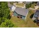 Aerial view of the back of a home featuring a wooden deck and spacious green lawn at 304 Nelson Ln, Clayton, NC 27527