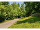 Scenic walking path winding through lush greenery, perfect for a relaxing stroll at 304 Nelson Ln, Clayton, NC 27527