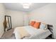 Comfortable bedroom with neutral paint, modern mirror and a comfortable bed at 3113 Chelmshire Ct, Raleigh, NC 27610