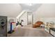 Versatile bonus room featuring comfortable seating, play area, and exercise equipment at 3113 Chelmshire Ct, Raleigh, NC 27610