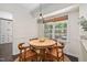 Cozy breakfast nook with wood table, chairs, natural light, and stylish pendant lighting at 3113 Chelmshire Ct, Raleigh, NC 27610
