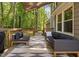Spacious deck with comfortable seating and a tranquil view of the surrounding greenery at 3113 Chelmshire Ct, Raleigh, NC 27610