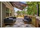 Inviting deck with stylish outdoor seating and a shade cover, perfect for relaxation at 3113 Chelmshire Ct, Raleigh, NC 27610