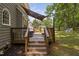 Multi-level deck with seating and a view of the lush green yard and neighborhood at 3113 Chelmshire Ct, Raleigh, NC 27610