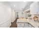 Open concept kitchen featuring granite countertops, white cabinets, and access to the breakfast nook at 3113 Chelmshire Ct, Raleigh, NC 27610