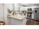 Bright kitchen with granite countertops, stainless steel appliances, and ample cabinet space at 3113 Chelmshire Ct, Raleigh, NC 27610