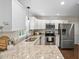 Bright kitchen features stainless steel appliances, granite countertops, and ample cabinet space at 3113 Chelmshire Ct, Raleigh, NC 27610