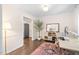 Inviting home office with built-in storage, a decorative rug, a live plant and a comfortable workspace at 3113 Chelmshire Ct, Raleigh, NC 27610