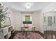Bright home office with dual monitors, a modern chair, storage shelves, and a large window at 3113 Chelmshire Ct, Raleigh, NC 27610