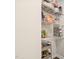 Organized pantry with wire shelving and a rolling cart for convenient storage of groceries and household items at 3113 Chelmshire Ct, Raleigh, NC 27610