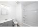 Updated bathroom featuring a shower-tub combo, vanity and tile floors at 327 Woodbridge Dr, Chapel Hill, NC 27516