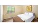 Cozy bedroom with a sunlit window, comfy bed, and decorative painting at 327 Woodbridge Dr, Chapel Hill, NC 27516