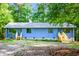 Charming one-story home featuring wood accents and a wooded lot at 327 Woodbridge Dr, Chapel Hill, NC 27516