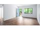 Sunlit living room featuring wood-look floors and a view of the outdoors at 327 Woodbridge Dr, Chapel Hill, NC 27516