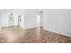 Open living space with wood-look floors and neutral paint at 327 Woodbridge Dr, Chapel Hill, NC 27516
