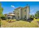 Expansive backyard featuring a covered patio, outdoor seating, and well-maintained landscaping at 3633 Willow Stone Ln, Wake Forest, NC 27587