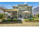 Relaxing screened porch and patio with outdoor seating in landscaped backyard at 3633 Willow Stone Ln, Wake Forest, NC 27587