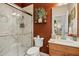 Bathroom featuring a glass-enclosed shower and a wooden vanity with a bright sink at 3633 Willow Stone Ln, Wake Forest, NC 27587