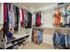 Walk-in closet with built-in shelving and hanging rods for optimal storage at 3633 Willow Stone Ln, Wake Forest, NC 27587