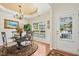 Elegant dining room featuring a decorative chandelier and views of the backyard at 3633 Willow Stone Ln, Wake Forest, NC 27587