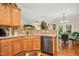 Spacious kitchen with granite countertops, stainless steel appliances, and hardwood floors at 3633 Willow Stone Ln, Wake Forest, NC 27587