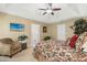 Spacious main bedroom with a tray ceiling and a cozy reading nook and en suite bathroom at 3633 Willow Stone Ln, Wake Forest, NC 27587