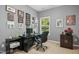 Functional office space with desk, computer, and natural light from a large window at 3633 Willow Stone Ln, Wake Forest, NC 27587