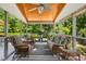 Relaxing screened porch with wicker furniture, offering an inviting outdoor living space at 3633 Willow Stone Ln, Wake Forest, NC 27587