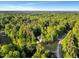 Bird's-eye view of a beautiful home enveloped by a lush, green forest at 3650 Brooks Bnd, Franklinton, NC 27525