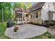 A lovely home features a spacious backyard patio, screened-in porch, and beautiful landscaping at 3650 Brooks Bnd, Franklinton, NC 27525