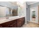 Spacious bathroom featuring double sinks, a large mirror, and tile flooring, providing functionality and elegance at 3650 Brooks Bnd, Franklinton, NC 27525