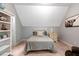 Comfortable bedroom featuring an sloped ceiling, soft carpet, and built-in shelves at 3650 Brooks Bnd, Franklinton, NC 27525
