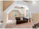 Large bonus room featuring vaulted ceilings, a comfortable leather sofa, and natural light from the window at 3650 Brooks Bnd, Franklinton, NC 27525