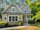 Charming two-story home featuring a welcoming front porch, attractive stone accents, and beautifully manicured landscaping at 3650 Brooks Bnd, Franklinton, NC 27525
