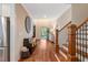 Inviting foyer area showcases hardwood floors, a staircase, and seamless transition to living spaces at 3650 Brooks Bnd, Franklinton, NC 27525