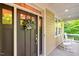 Inviting front porch with rocking chairs and a beautifully decorated front door welcomes you home at 3650 Brooks Bnd, Franklinton, NC 27525