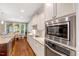 Bright kitchen with stainless steel appliances, granite countertops, and ample cabinet space at 3650 Brooks Bnd, Franklinton, NC 27525