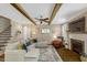Inviting living room with a stone fireplace, ceiling beams, and ample seating at 3650 Brooks Bnd, Franklinton, NC 27525