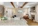 Bright living room with granite countertops in view and a stone fireplace at 3650 Brooks Bnd, Franklinton, NC 27525