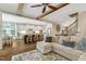 Open-concept living room and kitchen features wood beams, stainless steel appliances, and a spacious island at 3650 Brooks Bnd, Franklinton, NC 27525