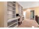 Bright home office featuring built-in bookshelves, desk, and plush carpeting at 3650 Brooks Bnd, Franklinton, NC 27525
